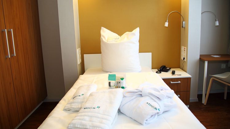 Privita Zimmer mit einem frisch gemachten Bett